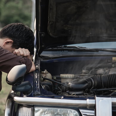 man-try-fix-car-engine-problem-local-road.jpg